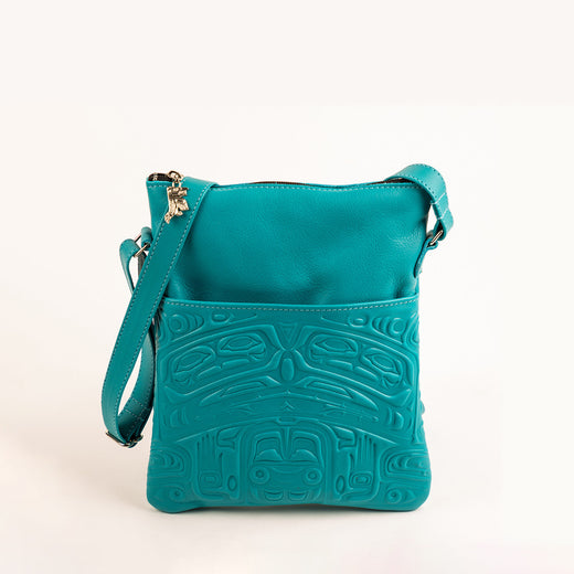 sac de turquoise avec un motif autochtone traditionnel représentant un ours, estampé en relief
