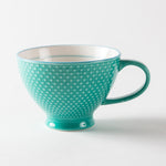 Tasse turquoise à l’extérieur texturé